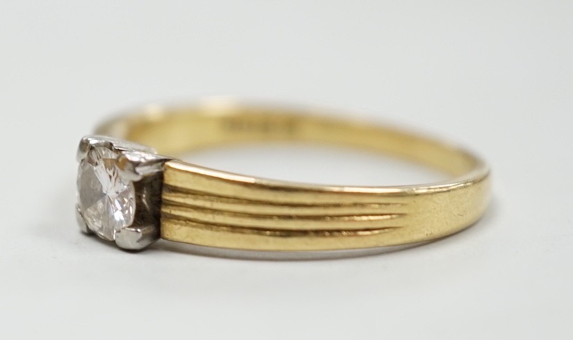 A 1960's 18ct gold and solitaire diamond ring, size M, gross weight 3.6 grams.